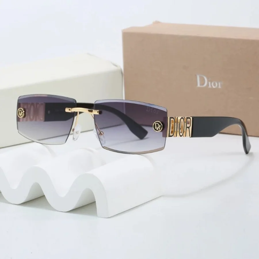 Dark gradient rimless sunglasses displayed with presentation boxes