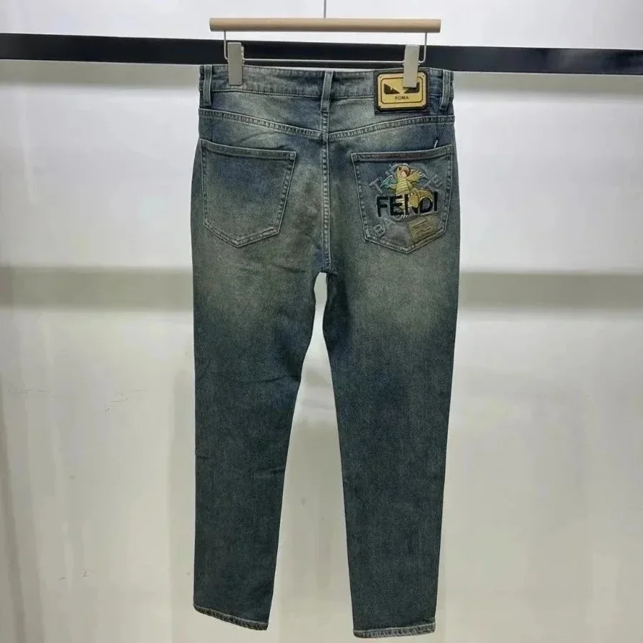 Blue denim jeans shown from the back on a hanger