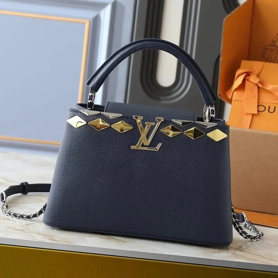 Dark structured mini handbag with metallic decorative details