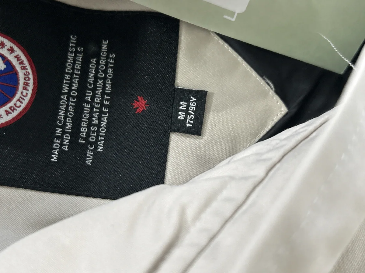 Close QC photo of the parka size label showing M and 175/96Y